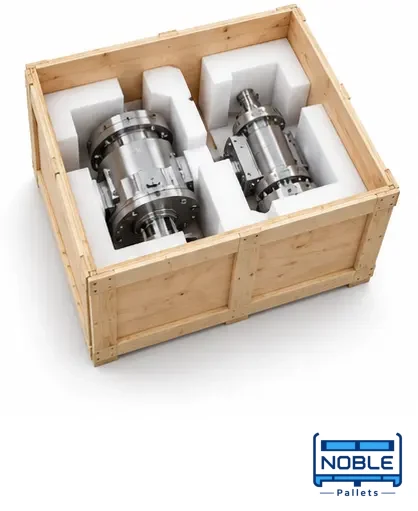 Metal components separated by cushioning inside a wooden packing case. Noble Pallets & Packaging, Pakistan.